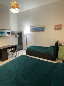 Posteľ alebo postele v izbe v ubytovaní Dante Rooms