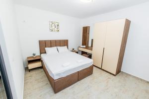 Ένα ή περισσότερα κρεβάτια σε δωμάτιο στο Lira Suites