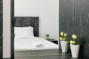 Ένα ή περισσότερα κρεβάτια σε δωμάτιο στο Lira Suites