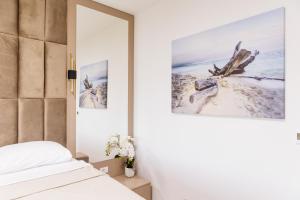Ένα ή περισσότερα κρεβάτια σε δωμάτιο στο Lira Suites