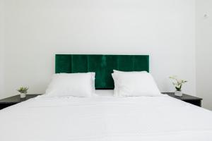 Ένα ή περισσότερα κρεβάτια σε δωμάτιο στο Lira Suites