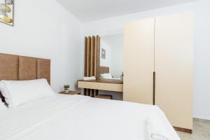 Ένα ή περισσότερα κρεβάτια σε δωμάτιο στο Lira Suites