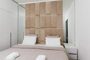 Ένα ή περισσότερα κρεβάτια σε δωμάτιο στο Lira Suites
