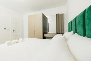 Ένα ή περισσότερα κρεβάτια σε δωμάτιο στο Lira Suites