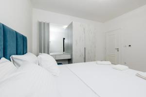 Postel nebo postele na pokoji v ubytování Lira Suites