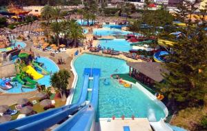 an aerial view of a water park with several pools at Luxury Suites Fuengirola 2 in Fuengirola