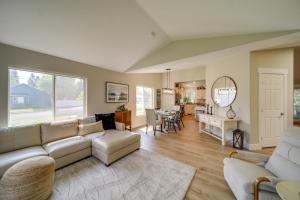 a living room with a couch and a table at Coeur dAlene Vacation Rental about 4 Mi to the Lake! in Coeur d'Alene