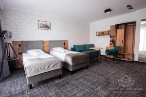 Postel nebo postele na pokoji v ubytování Hotel Polonia PARK Medical Center & Spa