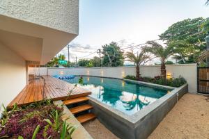 a swimming pool in the backyard of a house at Charming 2-Bed Apartment in Grand Baie in Grand Baie