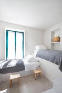 A bed or beds in a room at Poseidon Hotel