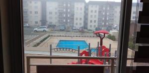 a view of a playground from a window at Apartamento Villarrica in Villarrica