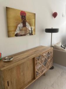 a living room with a tv on the wall at Escale à Saint-Tropez in Saint-Tropez +3 photos