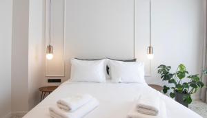 Letto o letti in una camera di Mythodea Athens Suites