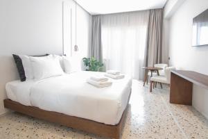 Letto o letti in una camera di Mythodea Athens Suites