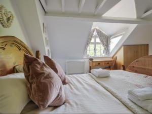 a bedroom with a bed with a large window at 21 Mill Green in Lyme Regis