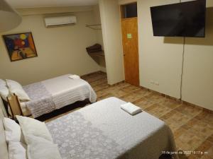 Cama ou camas em um quarto em Hotel El Huacachinero
