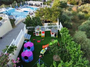 an aerial view of a backyard with a playground at Hotel Diamond in Limenaria