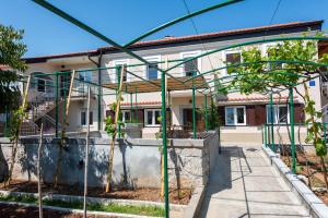 a house under construction with scaffolding in front of it at Casa Fiumana Laura in Rijeka +35 photos