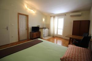 Кровать или кровати в номере Makarska centre & free private parking +9 фотографий