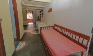 a room with two bunk beds and a living room at Estação Santa Fé Hotel e Pousada in Arraial d'Ajuda