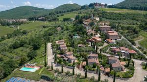 an aerial view of a house in a mountain at Villa Fiorella in Gaiole in Chianti