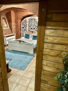 a room with a bed on a patio at Budget Family Hotel in Lviv