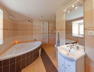 a large bathroom with a tub and a sink at Holiday home in Rokytnice n. J. 35171 in Rokytnice nad Jizerou +27 photos