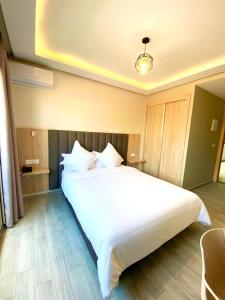 Voodi või voodid majutusasutuse HOTEL CAFE PALAIS SALAM , Beni Mellal toas