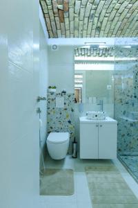 A bathroom at All seasons apartments Sarajevo with free parking