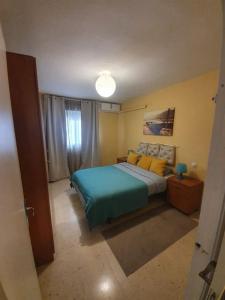 Posteľ alebo postele v izbe v ubytovaní Apartamento Carranque