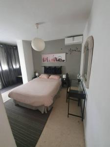 Posteľ alebo postele v izbe v ubytovaní Apartamento Carranque