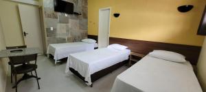 Sleep Suites客房内的一张或多张床位