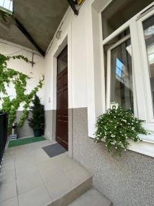 a front door of a house with a window at Budget Family Hotel in Lviv