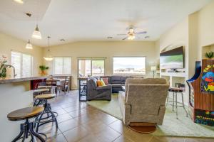 a living room with a couch and a table at Mesquite Vacation Rental - Close to Golf Courses! in Mesquite