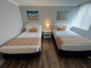 Postel nebo postele na pokoji v ubytování Pelican Pointe Clearwater Beach Hotel