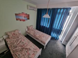 Postel nebo postele na pokoji v ubytování Guesthouse Flora