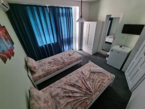 Postel nebo postele na pokoji v ubytování Guesthouse Flora