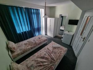 Postel nebo postele na pokoji v ubytování Guesthouse Flora