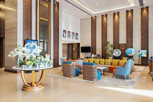 TV a/nebo společenská místnost v ubytování Ramee Dream Hotel Downtown