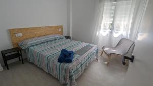 Postel nebo postele na pokoji v ubytování Ona Beach daimuz