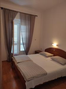 Postel nebo postele na pokoji v ubytování Apartment Rukavina