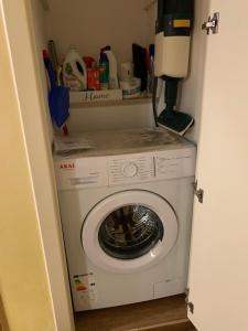 a washer and dryer in a small room at Casa Dante - Holiday House in Fasano