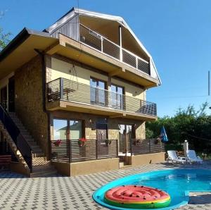 a villa with a swimming pool and a house at Villa Marina in Ohrid