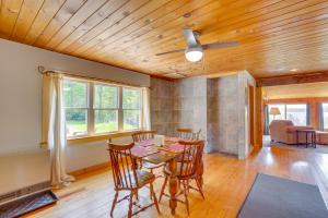 a dining room with a table and chairs at Beachfront Maine Retreat - Fire Pit, Grill and Canoe in Searsport