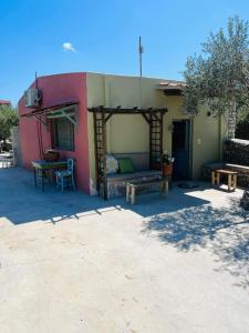 a house with a couch and a table in front of it at LOURA MANI'S 1 in Flomokhórion