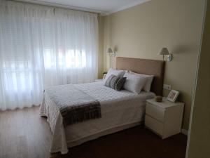 Postel nebo postele na pokoji v ubytování Apartamento Doctor Tourón