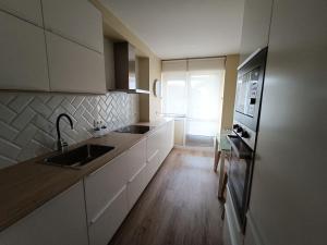 Kuchyň nebo kuchyňský kout v ubytování Apartamento Doctor Tourón
