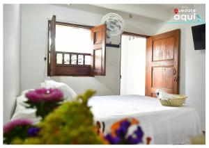 Postel nebo postele na pokoji v ubytování Hotel Quedate Aqui Barichara - El Original