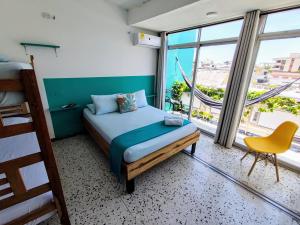 Bona Vida Hotel客房内的一张或多张床位
