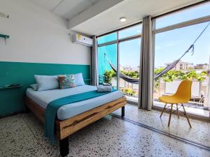 Bona Vida Hotel客房内的一张或多张床位